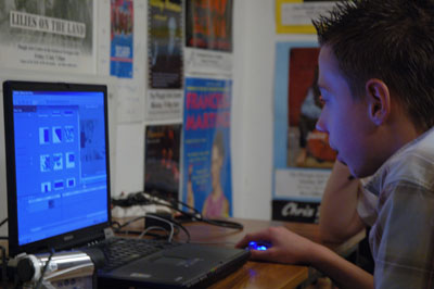 Working with IT Boy using laptop computer